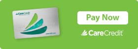 A green background with a white and blue credit card.