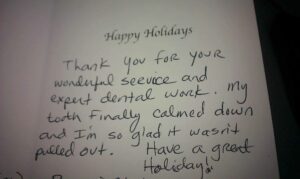 A handwritten note from the dentist about their holiday.